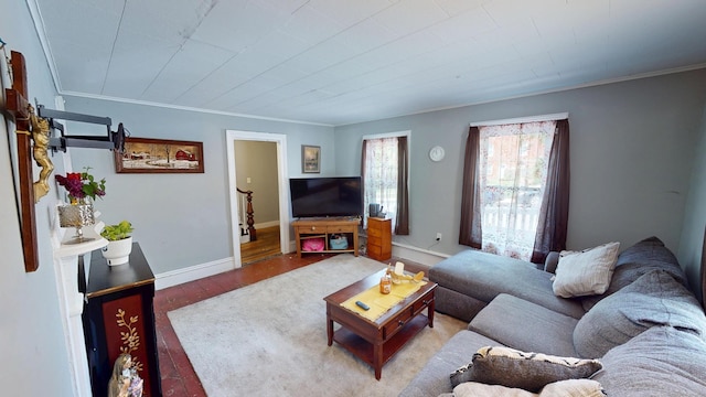 129 Walnut St, Windham, CT 06226 - living area featuring crown molding, wood finished floors, and baseboards