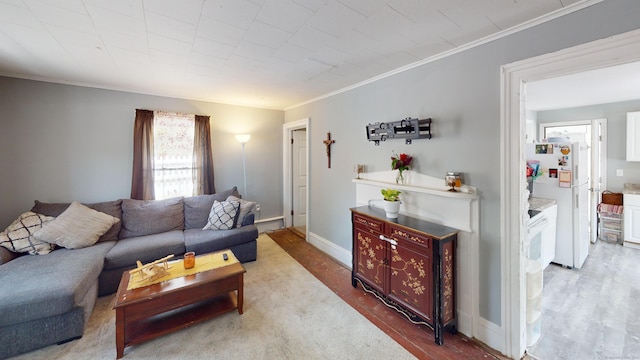 129 Walnut St, Windham, CT 06226 - living area featuring ornamental molding, baseboards, and wood finished floors