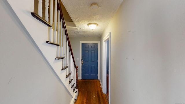 129 Walnut St, Windham, CT 06226 - hallway with a textured ceiling, wood finished floors, and stairs