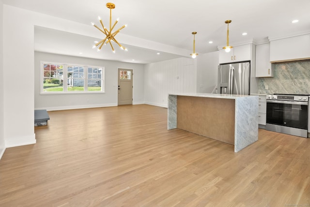 183 Pepperidge Cir, Fairfield, CT 06824 - kitchen featuring appliances with stainless steel finishes, recessed lighting, a chandelier, light wood finished floors, and white cabinets