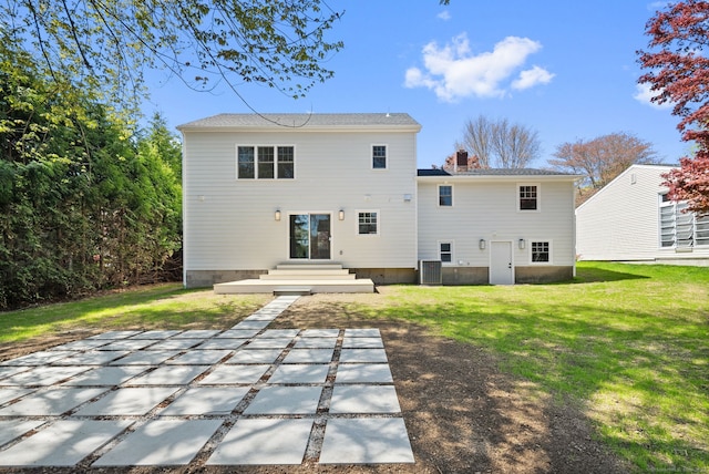 183 Pepperidge Cir, Fairfield, CT 06824 - rear view of house with a yard, a chimney, and central AC unit