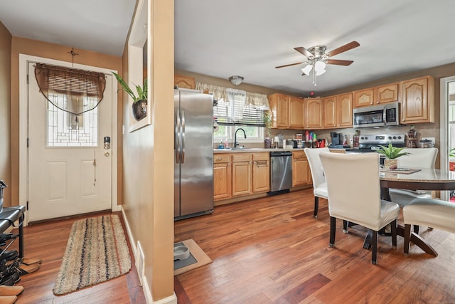 839 Washington Avenue Extension, Waterbury, CT 06708 - kitchen with appliances with stainless steel finishes, wood finished floors, ceiling fan, and light countertops