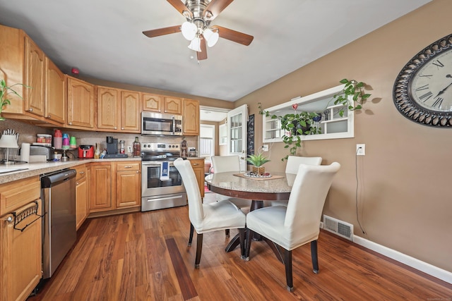 839 Washington Avenue Extension, Waterbury, CT 06708 - kitchen with stainless steel appliances, dark wood-style floors, light countertops, and ceiling fan