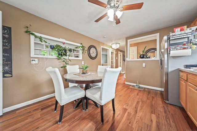 839 Washington Avenue Extension, Waterbury, CT 06708 - dining space featuring baseboards, light wood-style floors, and a ceiling fan