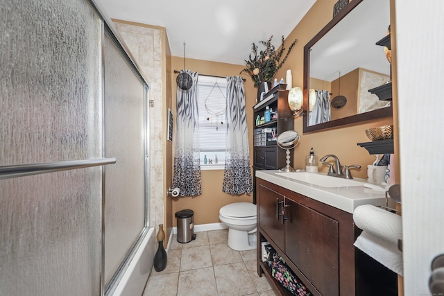839 Washington Avenue Extension, Waterbury, CT 06708 - full bath with toilet, vanity, tile patterned flooring, shower / bath combination with glass door, and baseboards