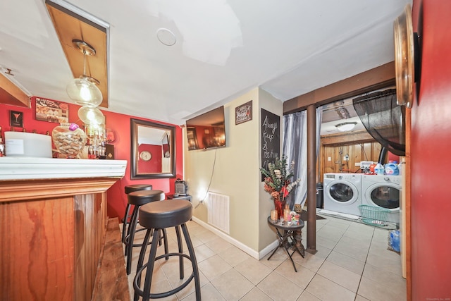 839 Washington Avenue Extension, Waterbury, CT 06708 - bar with separate washer and dryer, light tile patterned floors, and baseboards