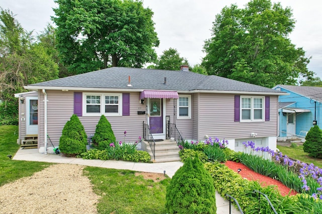 839 Washington Avenue Extension, Waterbury, CT 06708 - view of front facade with entry steps, a chimney, an attached garage, and a shingled roof
