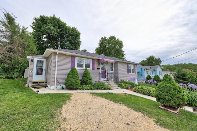 839 Washington Avenue Extension, Waterbury, CT 06708 - view of front of house featuring a front lawn and a chimney