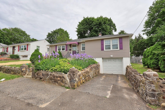 839 Washington Avenue Extension, Waterbury, CT 06708 - ranch-style house featuring asphalt driveway and an attached garage