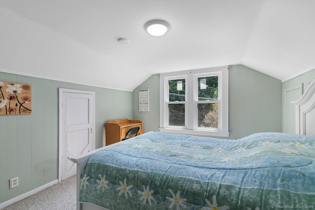 bedroom featuring carpet floors, baseboards, and lofted ceiling