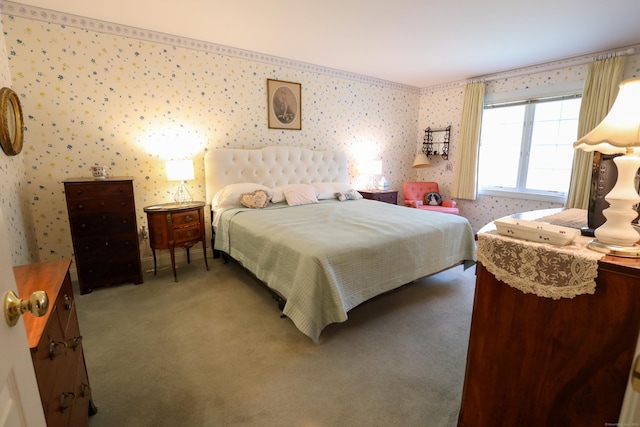 bedroom featuring wallpapered walls and carpet flooring