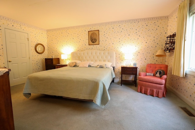 bedroom with wallpapered walls, carpet flooring, and baseboards