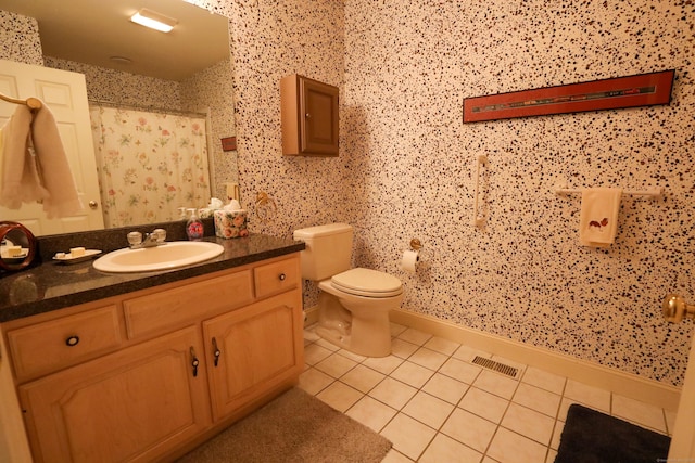 bathroom featuring tile patterned flooring, toilet, a shower with curtain, and vanity
