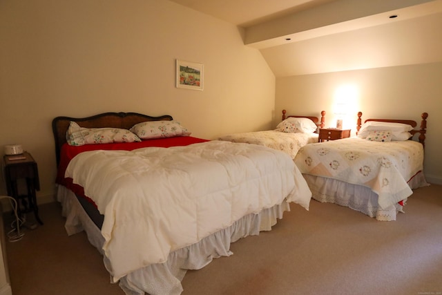 bedroom featuring vaulted ceiling and carpet flooring