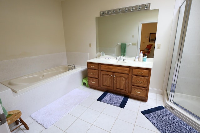 bathroom with vanity, a shower stall, a bath, and tile patterned flooring