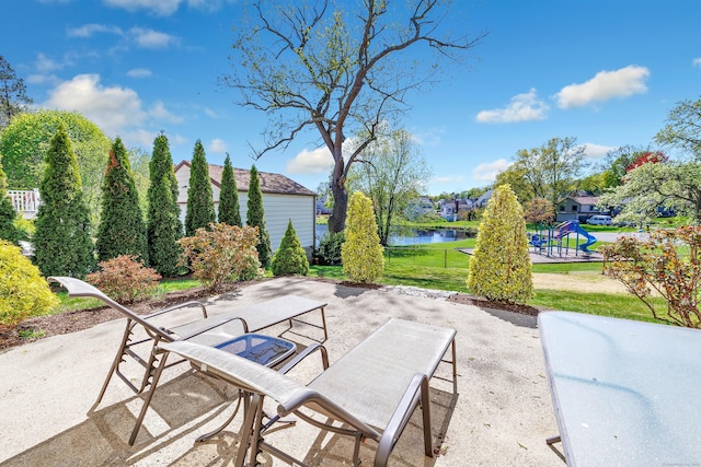 view of patio with a water view