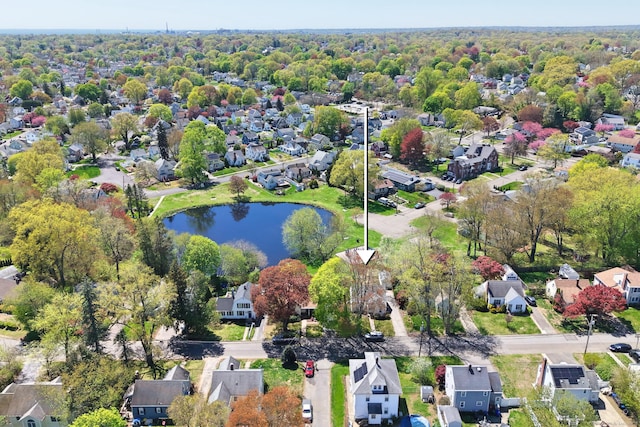 birds eye view of property with a residential view and a water view