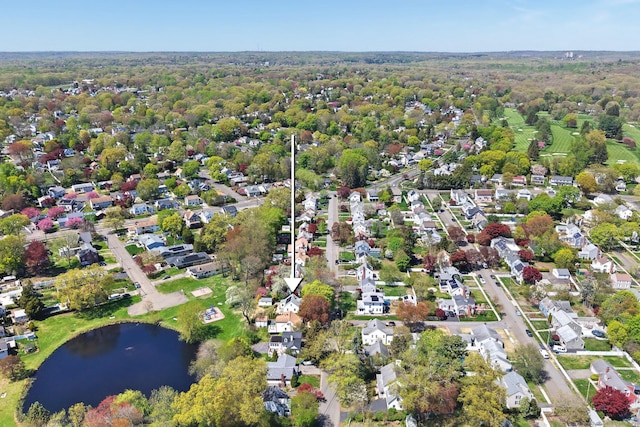 drone / aerial view with a water view and a residential view