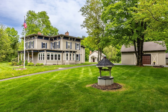 290 Waterville Rd, Avon, CT 06001 - rear view of property featuring a chimney, a lawn, and an outdoor structure