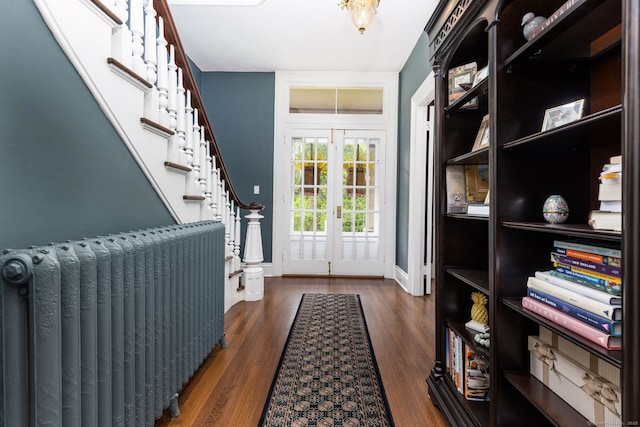 290 Waterville Rd, Avon, CT 06001 - doorway to outside with radiator, french doors, wood finished floors, baseboards, and stairs