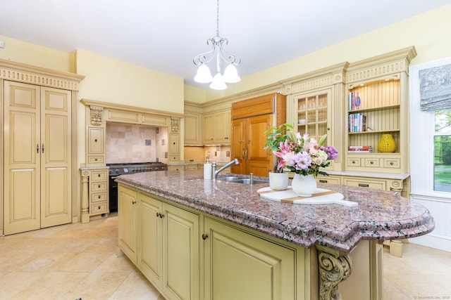290 Waterville Rd, Avon, CT 06001 - kitchen featuring cream cabinetry, stainless steel stove, a chandelier, and light tile patterned floors