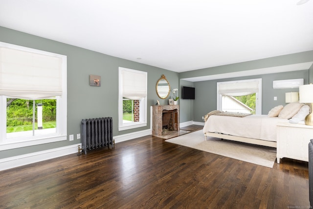 290 Waterville Rd, Avon, CT 06001 - bedroom featuring radiator heating unit, wood finished floors, baseboards, and an AC wall unit