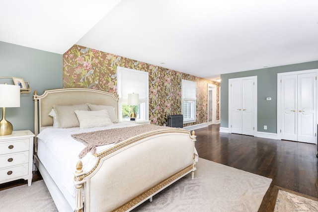 290 Waterville Rd, Avon, CT 06001 - bedroom featuring wallpapered walls, wood finished floors, two closets, and baseboards
