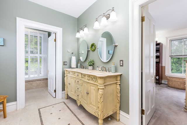 290 Waterville Rd, Avon, CT 06001 - full bathroom with double vanity, a baseboard heating unit, baseboards, and tile patterned floors