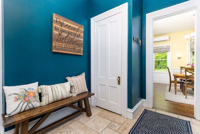 290 Waterville Rd, Avon, CT 06001 - mudroom featuring a wall mounted air conditioner, baseboards, a chandelier, and stone tile flooring
