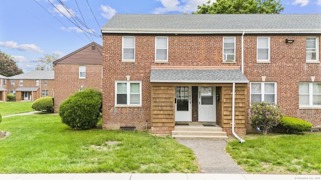 103 Louisiana Ave Unit 103, Bridgeport, CT 06610 - view of front of house with a front lawn, brick siding, and roof with shingles