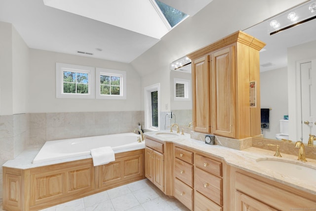 full bath with a sink, tile patterned flooring, double vanity, and visible vents