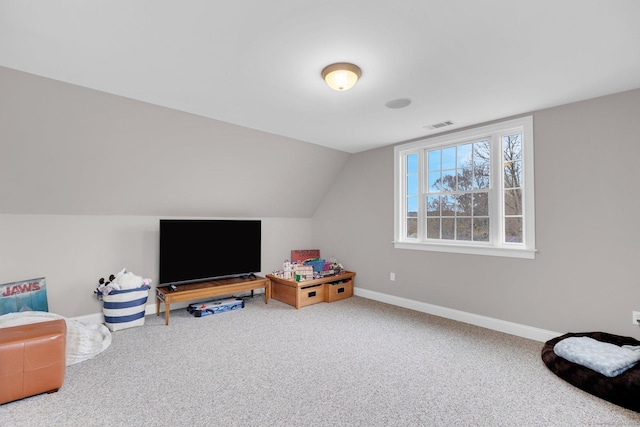 recreation room featuring carpet floors, baseboards, visible vents, and lofted ceiling