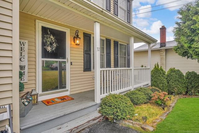 property entrance with covered porch