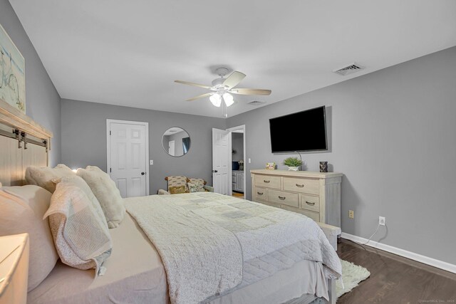 37 Lakeview Ave, Shelton, CT 06484 - bedroom with baseboards, dark wood-style flooring, ceiling fan, and a barn door