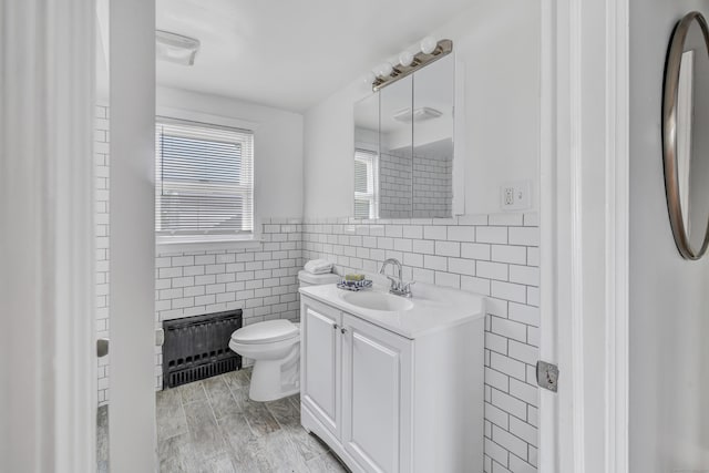 84 Oxford St, Bridgeport, CT 06606 - bathroom with tile walls, vanity, and radiator