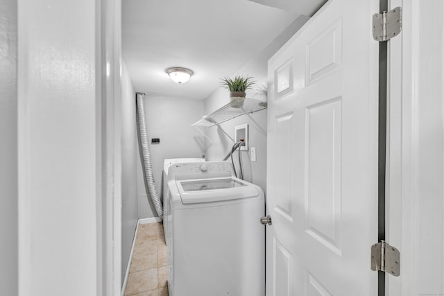84 Oxford St, Bridgeport, CT 06606 - laundry room featuring independent washer and dryer and light tile patterned flooring
