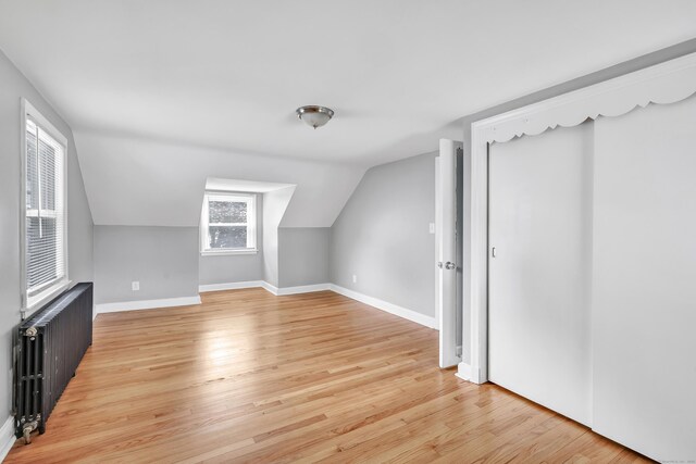 84 Oxford St, Bridgeport, CT 06606 - additional living space featuring radiator, light wood-type flooring, and vaulted ceiling
