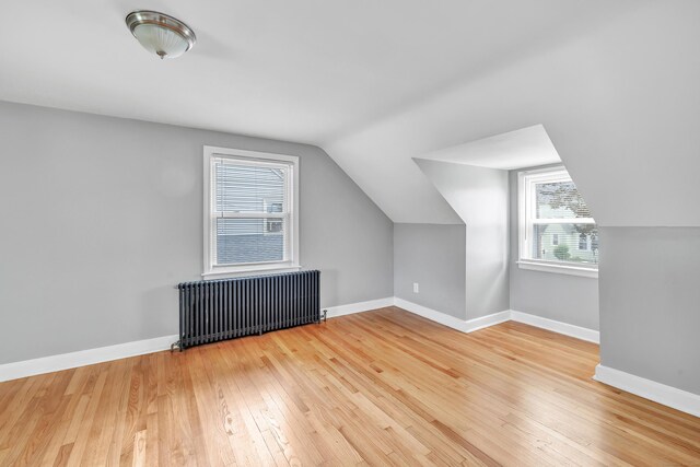 84 Oxford St, Bridgeport, CT 06606 - additional living space featuring radiator, hardwood / wood-style flooring, plenty of natural light, and lofted ceiling