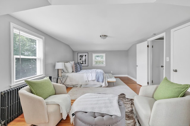 84 Oxford St, Bridgeport, CT 06606 - bedroom featuring radiator heating unit, wood finished floors, and lofted ceiling