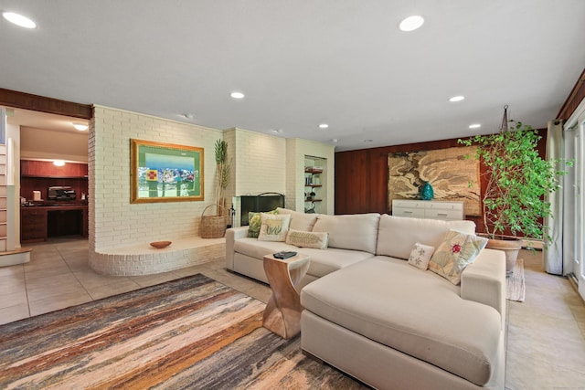 living area featuring recessed lighting and light tile patterned floors