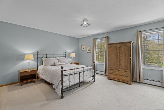 bedroom with light colored carpet, baseboards, a baseboard heating unit, and multiple windows