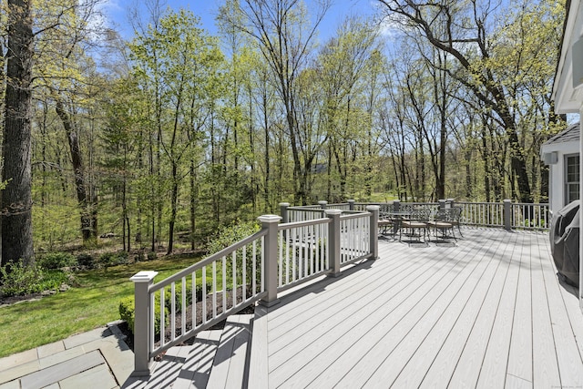 wooden terrace featuring outdoor dining space