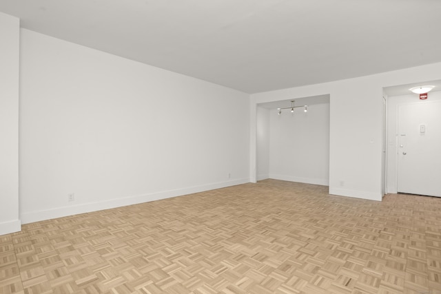 empty room featuring baseboards