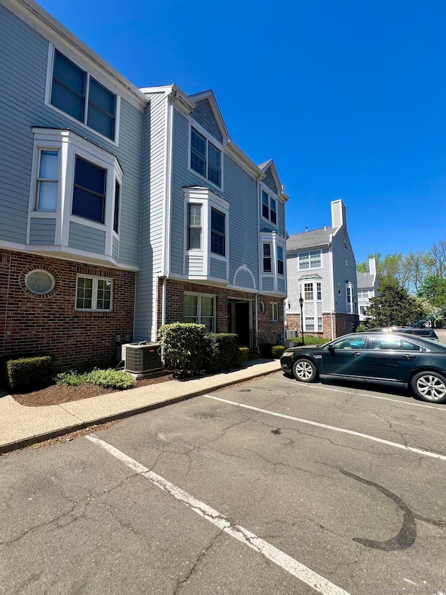 exterior space featuring uncovered parking and central AC