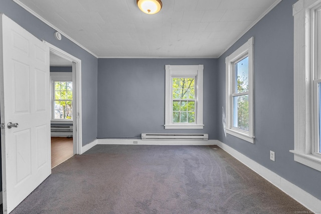 spare room with crown molding, baseboards, baseboard heating, and dark carpet
