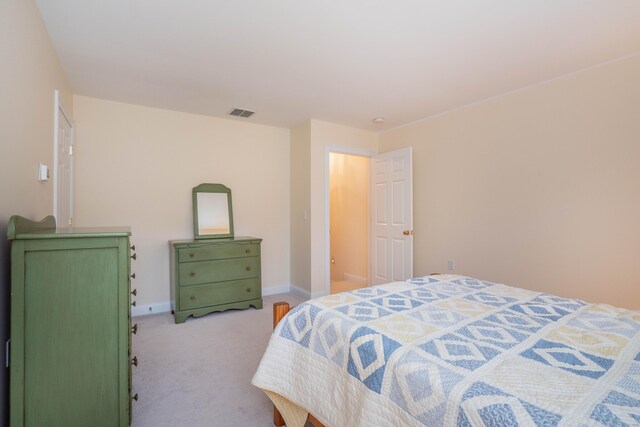 carpeted bedroom with baseboards