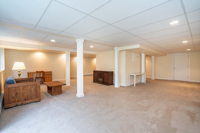 finished below grade area with light carpet, recessed lighting, baseboard heating, a paneled ceiling, and baseboards