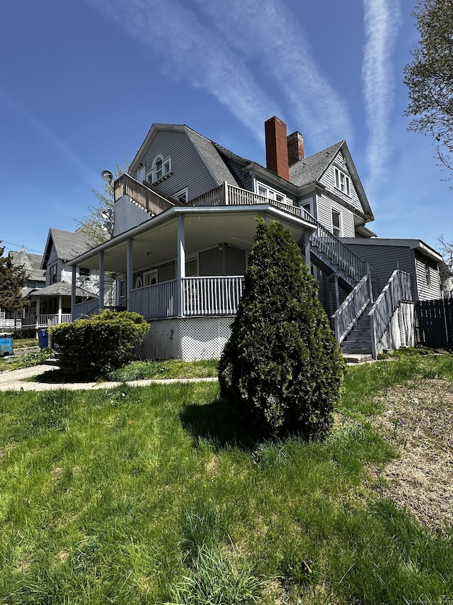 back of property with a yard