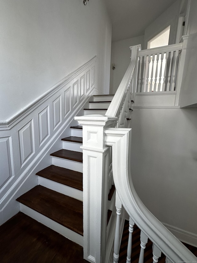 staircase featuring wood finished floors