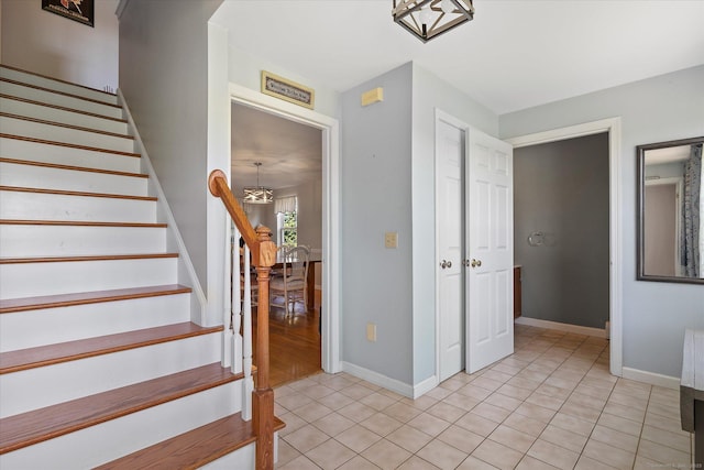 6 Margaret Cir, Pomfret, CT 06259 - staircase with baseboards, a notable chandelier, and tile patterned flooring